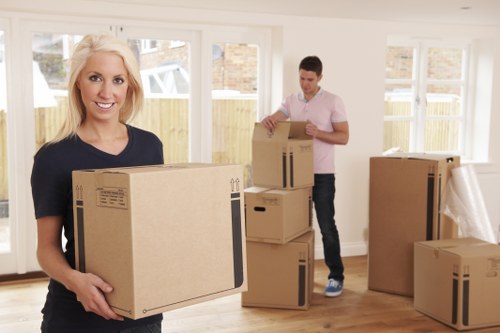 Removal team carefully loading boxes and furniture for a Queens Park move
