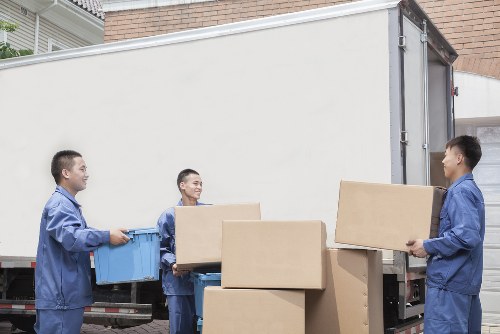 Loading boxes and household items into a van for a local move