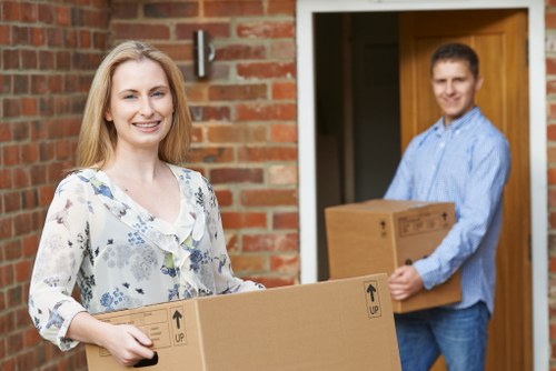 Office relocation planning in Queens Park with moving team and packed boxes