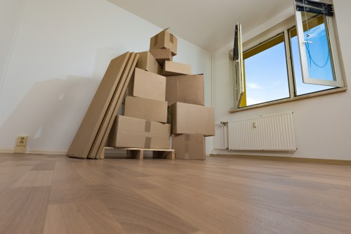 Packing supplies and neatly labelled moving boxes prepared for a Queens Park home move