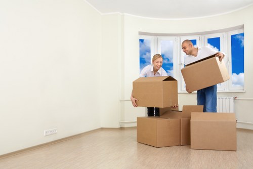 Business furniture being moved through Queens Park office premises