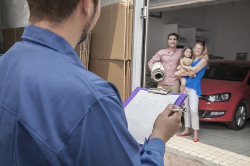 Professional movers planning a residential relocation in Queens Park