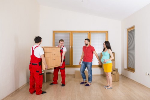 Packed boxes and furniture ready for a family house move in Queens Park