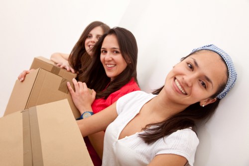 Unpacking and organising boxes in a newly moved-in Queens Park property