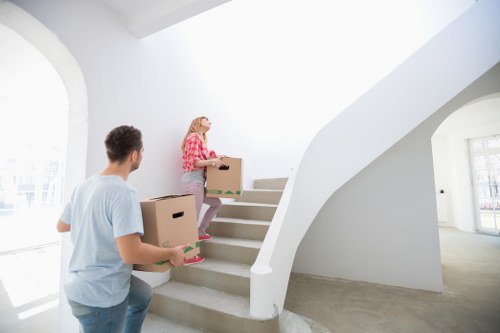 Local removals crew loading furniture for a move in Queens Park