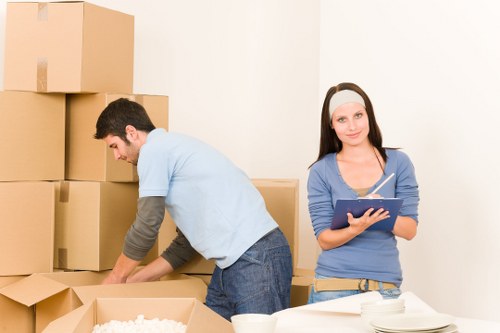 Local flat moving team loading belongings for a Queens Park relocation