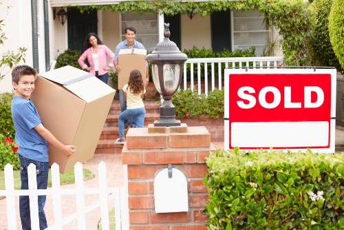 Removal Company Queens Park explaining transparent pricing near busy streets