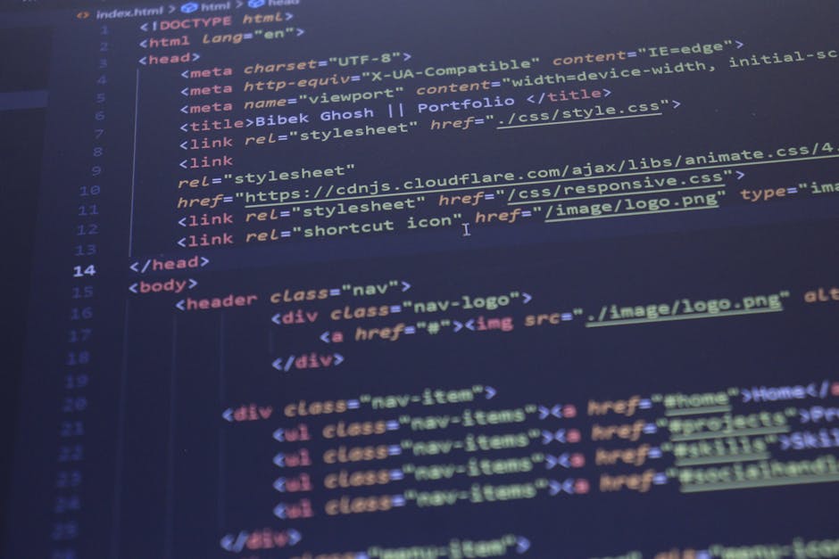 Inside a home during a furniture transport or packing process, a laptop displaying lines of code is positioned on a wooden surface adjacent to a ceramic mug with the phrase 'This coffee is making me a